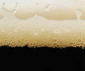 Foto auf Leinwand foam of dark beer with bubbles © texturis