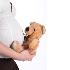 Pregnant mother holding a teddy