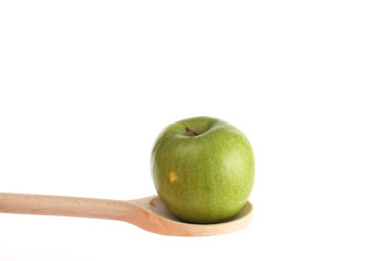 Apple on a wooden spoon