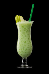 green apple cocktail on a black