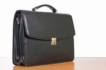 Fashionable leather briefcase on a table