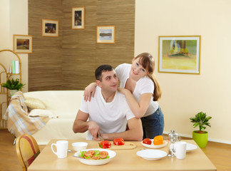 husband and wife at home in the kitchen