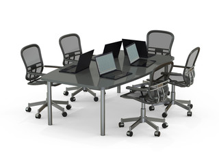 Conference table with laptops