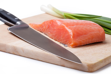 salmon pieces on a chopping board
