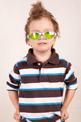 Portrait of  young boy in green glasses