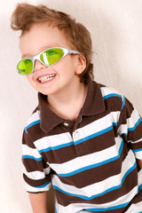 Portrait of  young boy in green glasses