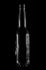 Beer bottle silhouette against black