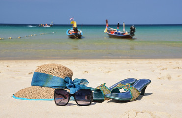 Fototapeta na wymiar Straw hat on the beach of Phuket island, Thailand