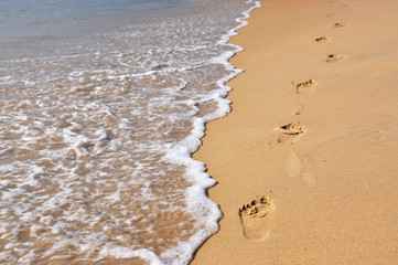 Footmarks on the sandy beach ..