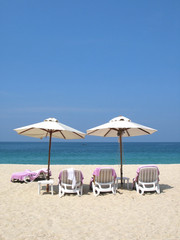 Obraz na płótnie Canvas Sun umbrellas and chairs on the Bangtao beach of Phuket island