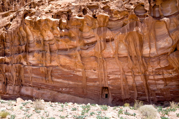 Small door in a big rock near the Monastery. Petra, Jordan