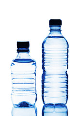 Two plastic bottles of water isolated on white background