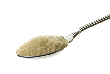 silver spoon full of brown sugar