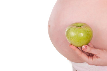Pregnant woman with green apple