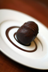 Rich chocolate cake on white plate