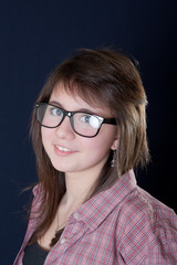 The girl wearing spectacles