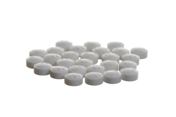 Isolated smiling  white pills over white background