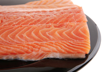 fresh uncooked red fish fillet on black