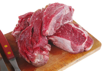 raw fillet mignon on cutting board