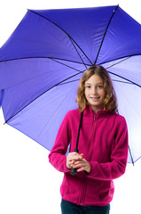 young girl holding a big purple umbrella