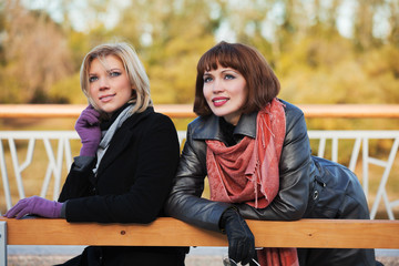 Two young women on a bench