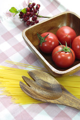 Tomato on wood plate