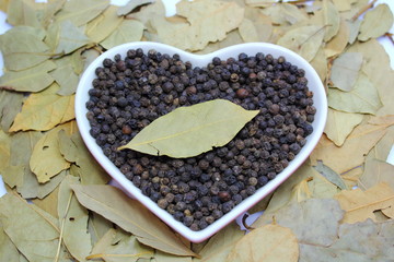 plate black pepper with bay leaves