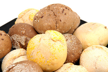 fresh baked buns in closeup over white background