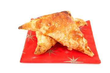 delicious apple fritters on napkin over white background