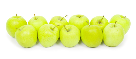 Green and yellow apples on a white baclground
