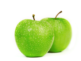 Green apples on a white background