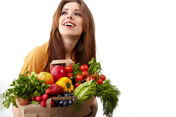 woman holding a bag full of healthy food. shopping .