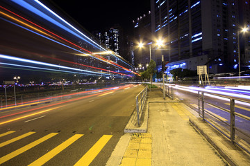 Fototapeta na wymiar blurred bus light trails in downtown night-scape