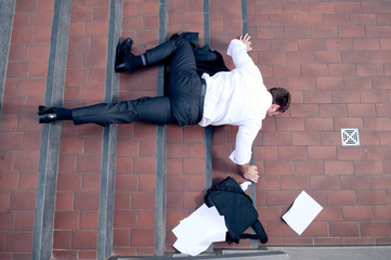 Businessman falling down the stairs - obrazy, fototapety, plakaty