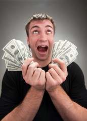 Very excited man with money