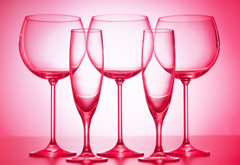 Wine glasses against gradient background