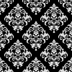 Seamless from leaves and flowers on black background