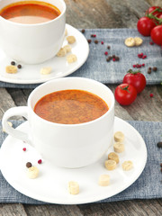 Tomato soup with fresh ingredients in a soup cup