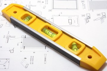 Yellow spirit level and plan