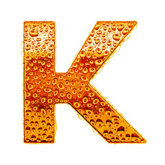 Orange gold alphabet symbol - letter K. Water splashes and drops