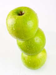 three green apples on white background