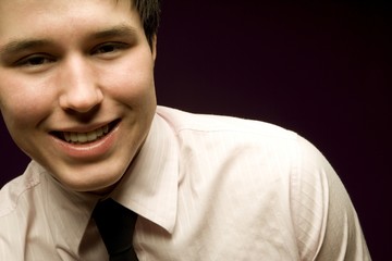 Young Man Smiling In Shirt And Tie