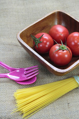 Tomato on wood plate