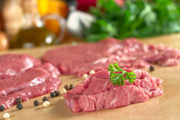 Fresh raw beef meat with parsley on top