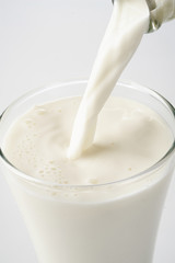 pouring a glass of milk