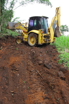 Utility Tractor And Road On Progress