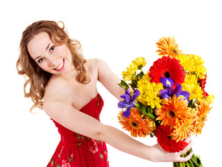 Happy young woman holding flowers.