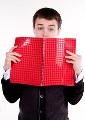 university college student or casual man with textbook.