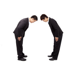 Two asian businessman with bow