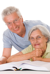 elderly couple together on a white